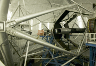 The Keck II telescope primary mirror. The DEIMOS instrument appears in the background. - Photo Credit: Rick Peterson