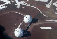 An aerial view of the twin Keck domes at the summit of Mauna Kea. - Joey Stein